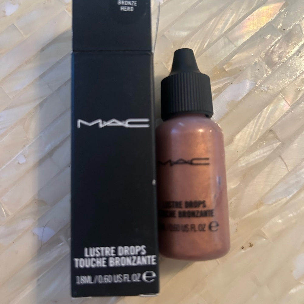 MAC never used Bronzing Drops! Add to your foundation, lotion, or use alone!